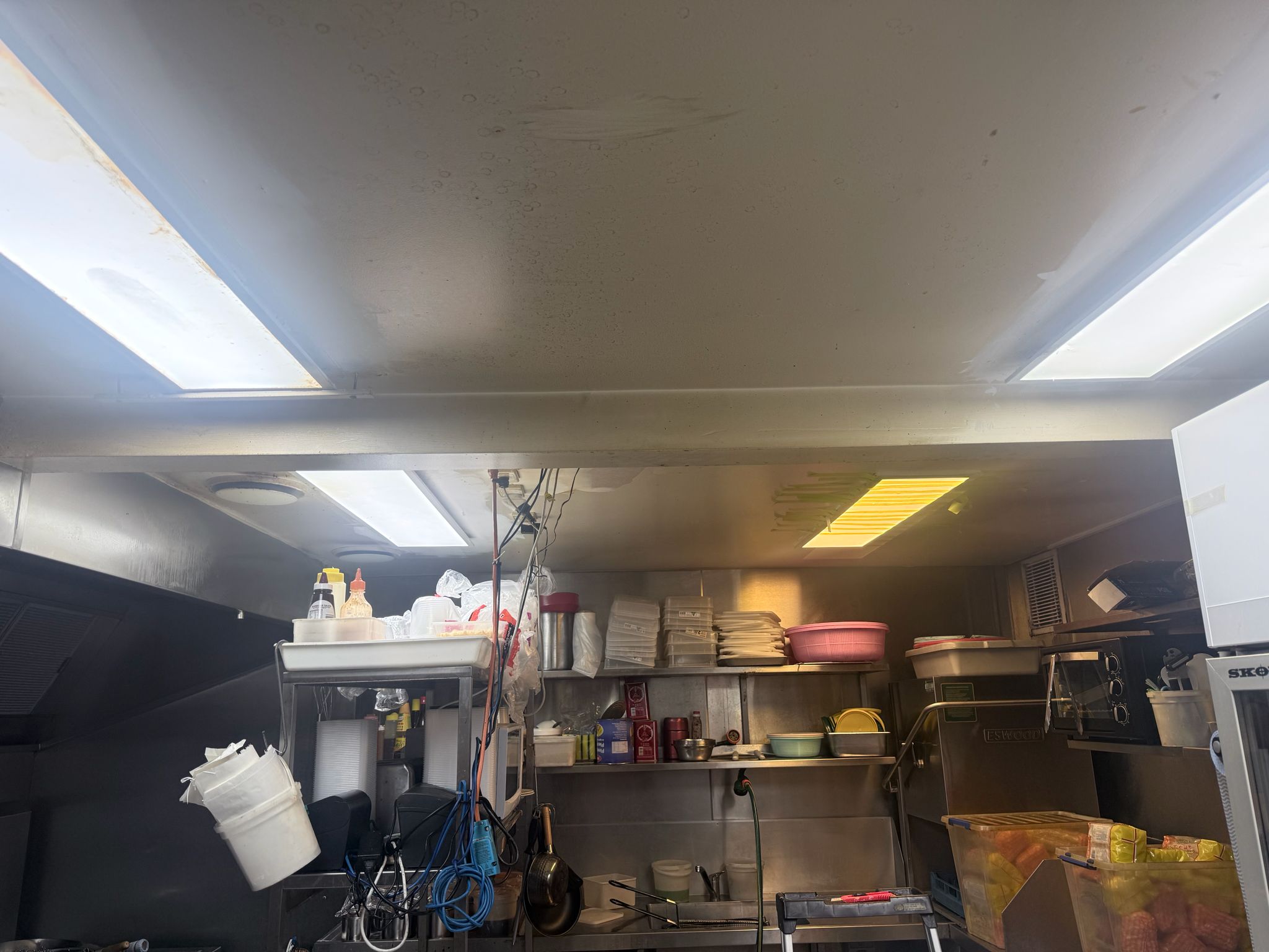 Kitchen ceiling before painting — stained and yellowed